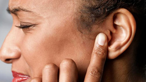 What causes pimples on the earlobes?